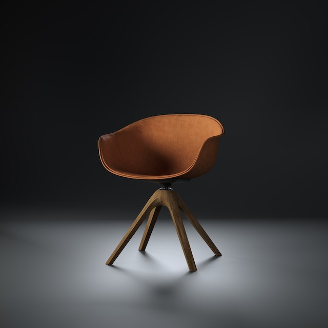 A brown chair in black background