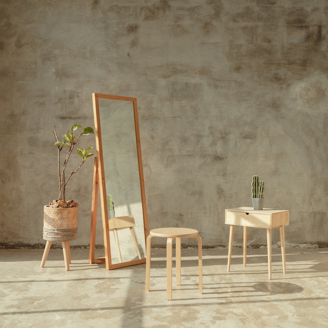 Brown wooden table and mirror