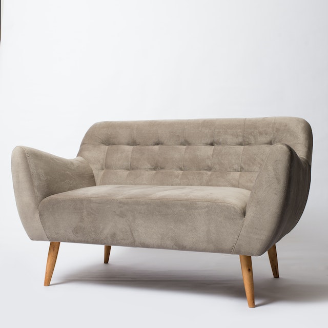 A sofa near a white wall