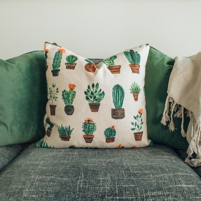 A white and green throw pillows